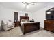 Spacious bedroom with a large bed, dresser, and seating area at 4146 Signal Sw Rdg, Lilburn, GA 30047