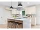 Modern kitchen with white cabinets, quartz countertops, and an island at 1980 Oakdale Se Ct, Smyrna, GA 30082