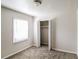 Cozy bedroom with neutral walls, plush carpeting, and ample closet space at 3900 Emerald North Dr, Decatur, GA 30035