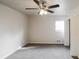 Spacious bedroom featuring carpeted floors, ceiling fan, and ample closet space at 3900 Emerald North Dr, Decatur, GA 30035