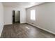 Bright, spacious living room with wood-look flooring and neutral walls at 3900 Emerald North Dr, Decatur, GA 30035