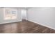 Living room with dark hardwood floors and neutral walls at 4054 Coopers Hill Se Dr, Smyrna, GA 30080