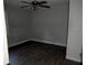 Small bedroom with gray walls and dark gray vinyl flooring at 4922 Rock Springs Rd, Lithonia, GA 30038