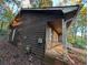 House exterior showcasing wooden siding and a side porch at 4922 Rock Springs Rd, Lithonia, GA 30038
