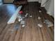 Hardwood floor with discarded items and door parts at 4922 Rock Springs Rd, Lithonia, GA 30038
