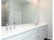 Double vanity bathroom with large mirror and shower at 1423 Creekside Nw Cir, Atlanta, GA 30318