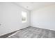 Bright bedroom with gray carpet and a large window at 1356 Creekside Nw Cir, Atlanta, GA 30318