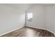Simple bedroom with wood-look flooring and a window at 318 Emporia Loop, Mcdonough, GA 30253
