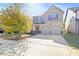Two-story house with a two-car garage and mature trees at 318 Emporia Loop, Mcdonough, GA 30253