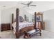 Spacious main bedroom with a large bed and ceiling fan at 318 Emporia Loop, Mcdonough, GA 30253