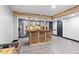 Basement features a bar with rustic wood countertops and a game area at 7802 Bamby Rd, Cumming, GA 30041