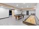 Finished basement with a pool table and shuffleboard at 7802 Bamby Rd, Cumming, GA 30041