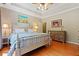 Bright bedroom with hardwood floors and a ceiling fan at 7802 Bamby Rd, Cumming, GA 30041