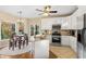 Modern kitchen with white cabinets, granite countertops, and stainless steel appliances at 7802 Bamby Rd, Cumming, GA 30041