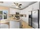 Updated kitchen with white cabinets, granite countertops, and stainless steel appliances at 7802 Bamby Rd, Cumming, GA 30041
