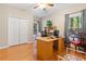 Bright office with hardwood floors and built-in desk at 7802 Bamby Rd, Cumming, GA 30041