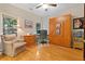 Home office features wood floors, built-in murphy bed and large windows at 7802 Bamby Rd, Cumming, GA 30041