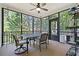 Enjoy the outdoors in this screened porch with seating area at 7802 Bamby Rd, Cumming, GA 30041