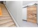 Stairs with chair lift and barn door at 7802 Bamby Rd, Cumming, GA 30041