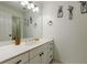 Clean bathroom with white vanity, mirror, and decorative wall art at 1112 Osprey Nw Rdg, Kennesaw, GA 30152