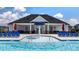 Community pool with a spray feature and plenty of seating at 158 Aster Ave, Locust Grove, GA 30248