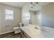 Clean bathroom featuring a single sink vanity and tub at 271 Kings Walk, Douglasville, GA 30134