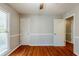 Simple bedroom with hardwood floors and neutral walls at 271 Kings Walk, Douglasville, GA 30134