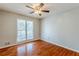Well-lit bedroom with hardwood floors and ceiling fan at 271 Kings Walk, Douglasville, GA 30134