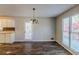 Dining room with hardwood floors, chandelier and door to back deck at 271 Kings Walk, Douglasville, GA 30134