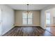Bright dining room with hardwood floors, chandelier, and access to a deck at 271 Kings Walk, Douglasville, GA 30134