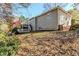 House exterior with a deck and sloping yard at 271 Kings Walk, Douglasville, GA 30134