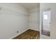 Laundry closet with built-in shelving at 271 Kings Walk, Douglasville, GA 30134