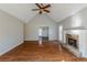 Living room with hardwood floors, stone fireplace and vaulted ceiling at 271 Kings Walk, Douglasville, GA 30134