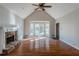 Spacious living room with hardwood floors, fireplace, and vaulted ceiling at 271 Kings Walk, Douglasville, GA 30134