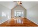 Bright living room with hardwood floors and vaulted ceiling at 271 Kings Walk, Douglasville, GA 30134