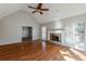 Living room with hardwood floors, stone fireplace and vaulted ceiling at 271 Kings Walk, Douglasville, GA 30134