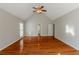 Spacious main bedroom featuring hardwood floors and ceiling fan at 271 Kings Walk, Douglasville, GA 30134