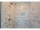 Clean shower with marble-style tile at 9183 Golfview Cir, Covington, GA 30014