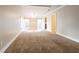 Living room with neutral carpeting and lots of light at 290 Charlotte Blvd, Stockbridge, GA 30281