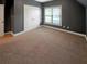 Bright bedroom with double doors and neutral carpet at 4330 Balsam Bark Dr, Cumming, GA 30028