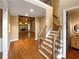 Two-story entryway with hardwood floors, staircase, and fireplace view at 4330 Balsam Bark Dr, Cumming, GA 30028