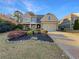 Two-story house with a front yard and driveway at 4330 Balsam Bark Dr, Cumming, GA 30028