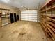 Two-car garage with built-in shelving at 4330 Balsam Bark Dr, Cumming, GA 30028