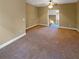 Spacious loft area with carpeted floor and view to the second floor at 4330 Balsam Bark Dr, Cumming, GA 30028
