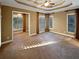 Spacious main bedroom with carpeted floors, and sitting area at 4330 Balsam Bark Dr, Cumming, GA 30028