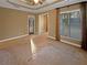 Main bedroom with carpeted floor, private access to the outside, and sitting area at 4330 Balsam Bark Dr, Cumming, GA 30028