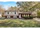 Brick ranch home with a covered porch and well-maintained landscaping at 2670 Foxlair Trl, Atlanta, GA 30349