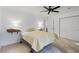 Bright bedroom with neutral walls, ceiling fan, and ample closet space at 3798 Valley Brook Rd, Snellville, GA 30039