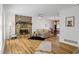 Living room with stone fireplace and hardwood floors at 3798 Valley Brook Rd, Snellville, GA 30039