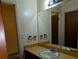 Clean bathroom with a vanity and a large mirror at 4414 Blackbirch Ln, Decatur, GA 30034